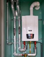 Chaudière de 20 kW Chaudière de 20 kW assurant le chauffage et l'ECS de huit logements